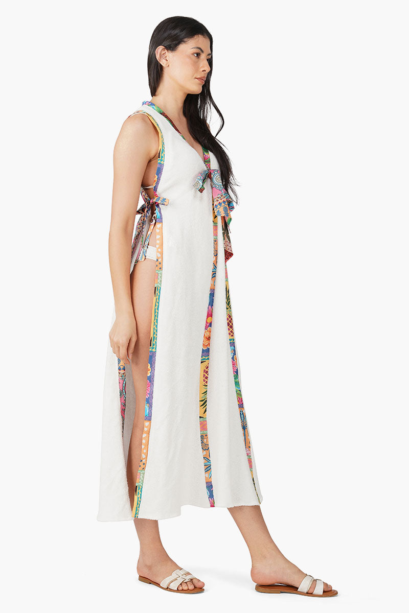 Side view of an off-white wrap style midi dress with multicolor printed trims and side tie fastening