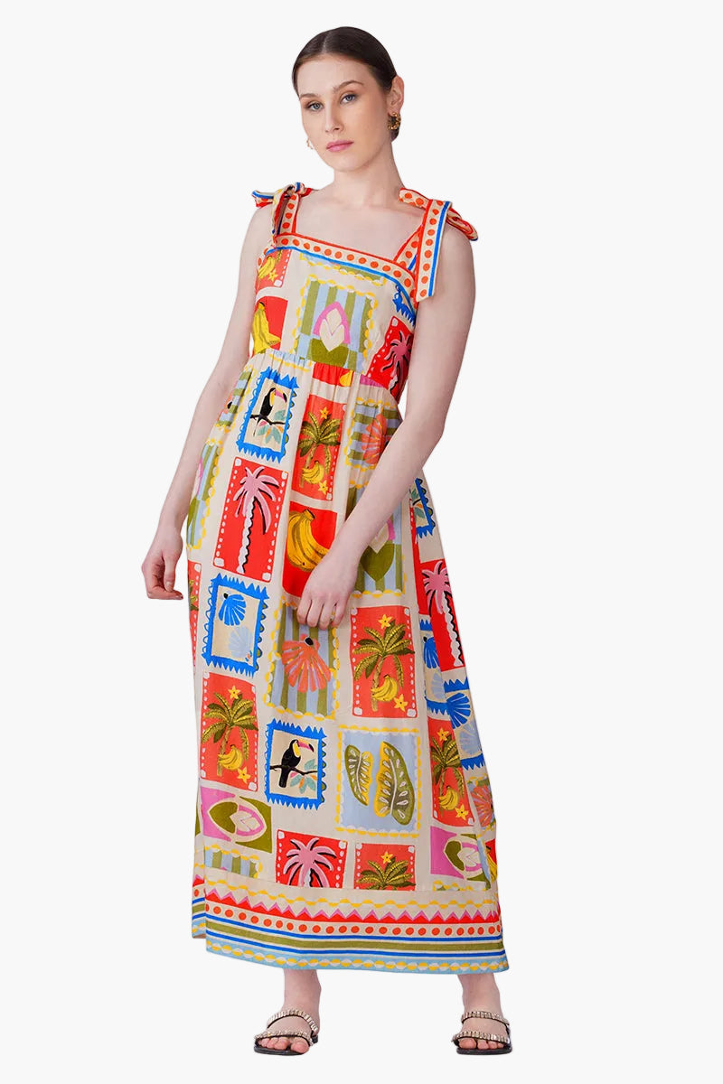 Woman wearing a colorful patterned dress on a white background